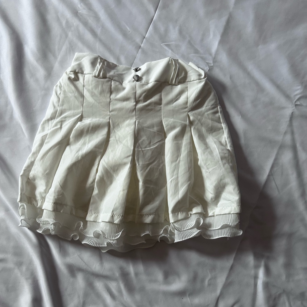 White Pleated Skirt with Ruffle Hem